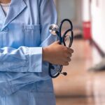 pngtree medical background of a doctor holding a stethoscope in the hospital image 754567 1