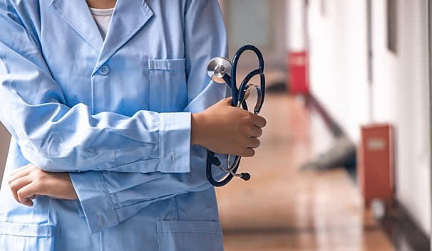 pngtree medical background of a doctor holding a stethoscope in the hospital image 754567 1